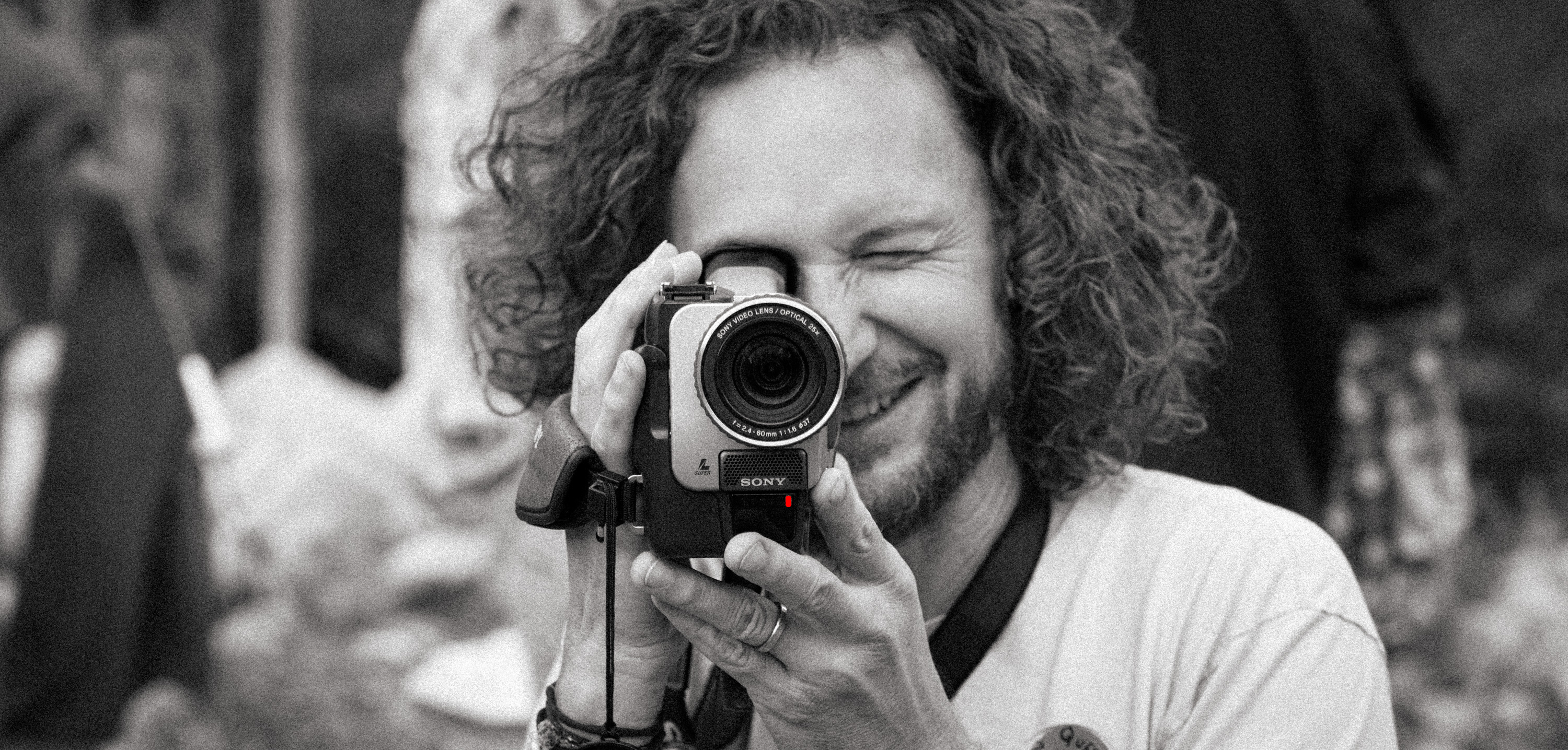 Joe with camcorder at an event